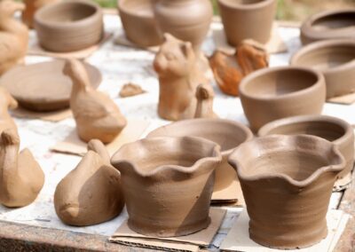 Handmade ceramic pottery on display, showcasing rustic charm and artistic craftsmanship.